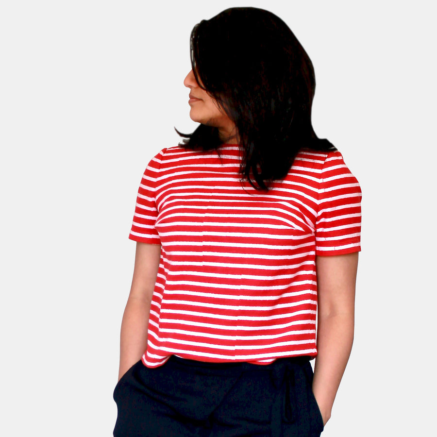 Side view of a female model wearing Eden Crop Top in Woodblock Print Cotton - Retro Red Stripes