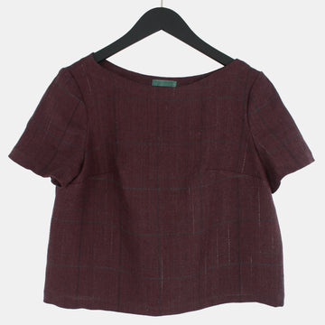 Womens Top in Midweight Linen on a black hanger. Color of the top is muted plum or brownish purple.