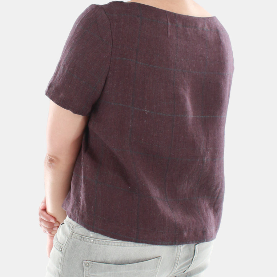 Back View of Womens Top in Midweight Linen. Color of the top is muted plum or brownish purple.