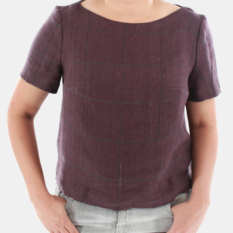 Front close up of Womens Top in Midweight Linen. Color of the top is muted plum or brownish purple with subtle checks.