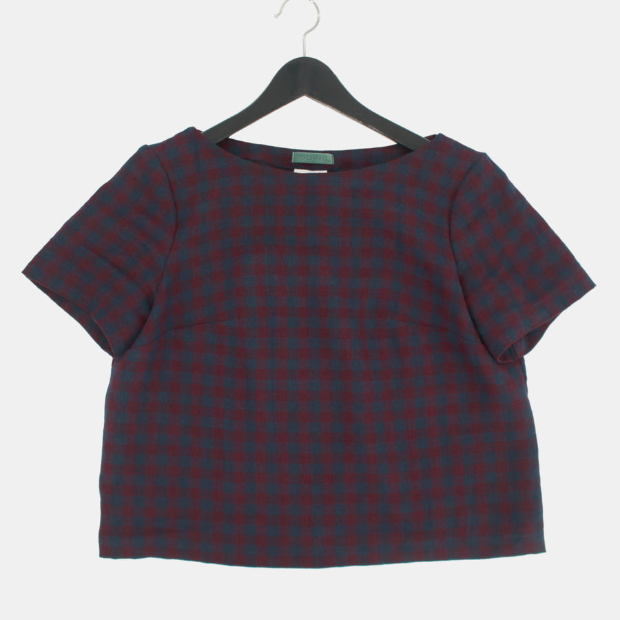 In a hanger, Womens Crop Top in Midweight Linen. Color of the top is autumnal or fall plum and navy checks